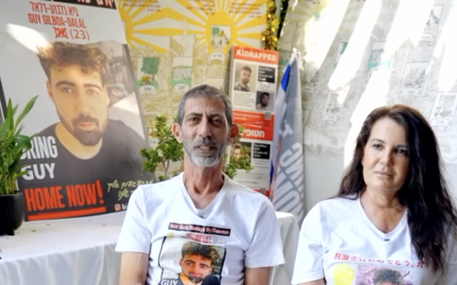 Meirav Gilboa-Dalal and Ilan Dalal sit in the sukkah, waiting for their son Guy to be released from Hamas captivity (Courtesy)